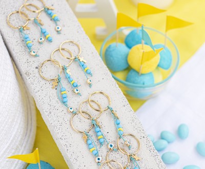 Μαρτυρικά σε μπρελόκ με μεταλλικά στοιχεία σταυρό και μάτι, ακρυλικές χάντρες και δερμάτινο κορδόνι