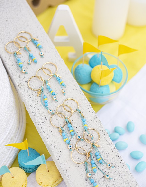 Μαρτυρικά σε μπρελόκ με μεταλλικά στοιχεία σταυρό και μάτι, ακρυλικές χάντρες και δερμάτινο κορδόνι